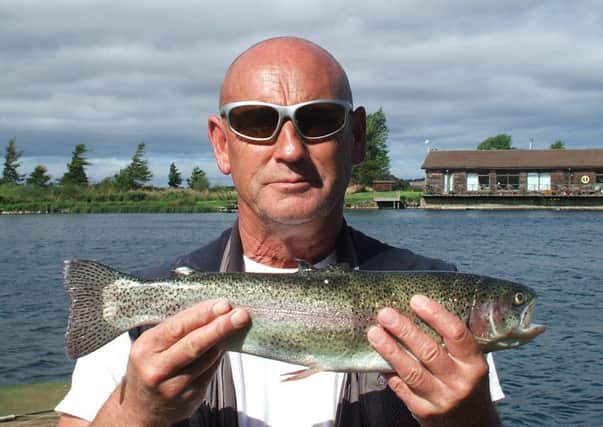 Bruce Hunter of Edinburgh with a 3lb rainbow taken on a bloodworm at Markle