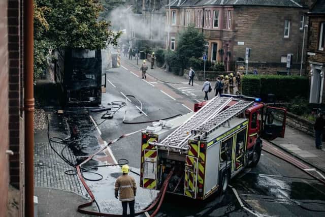 Fire brigade putting out a bus which had caught fire on Slateford Road. Picture: Michael Scott