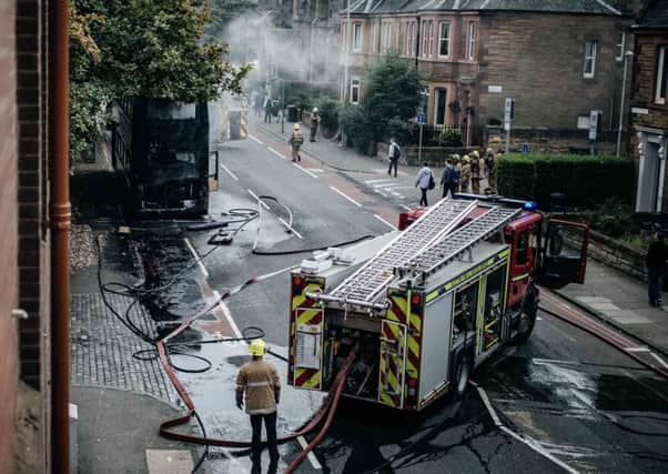 Fire brigade putting out a bus which had caught fire on Slateford Road. Picture: Michael Scott