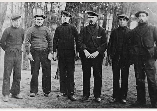 Crew of the Bella pictured in a German PoW camp after they were captured off the North East coast in 1916. They are pictured in their fishermen's jumpers and caps. From left to right as David Cargill, John Cargill, James Ritchie Jnr, skipper James Ritchie (Auld Briney), James Freeman Ritchie and William Ritchie. PIC Maggie Law Museum, Gourdon.