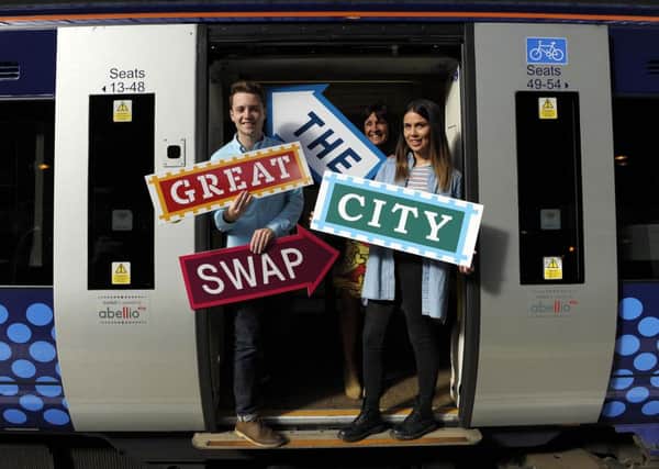 Jack Power from Merchiston, Miriam Keating from Riddrie centre and Denize Oakan from Merchiston
help promote the city swap. Picture: Andy Buchanan