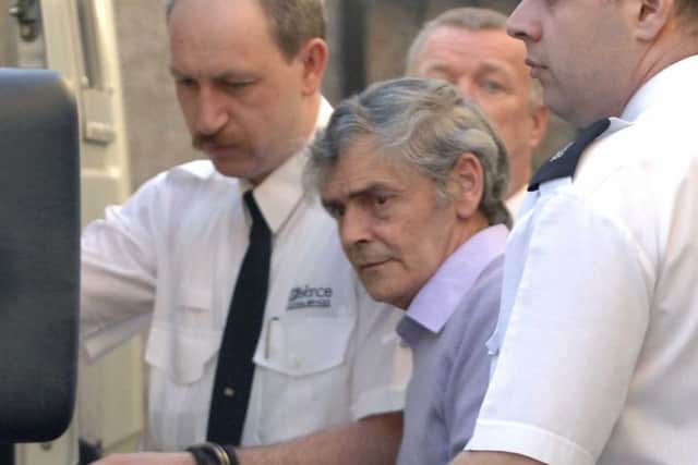 Tobin is led away from court. Picture: Ian Rutherford