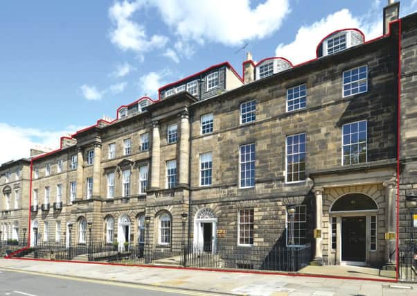 Five townhouses in Charlotte Square are on the market.
