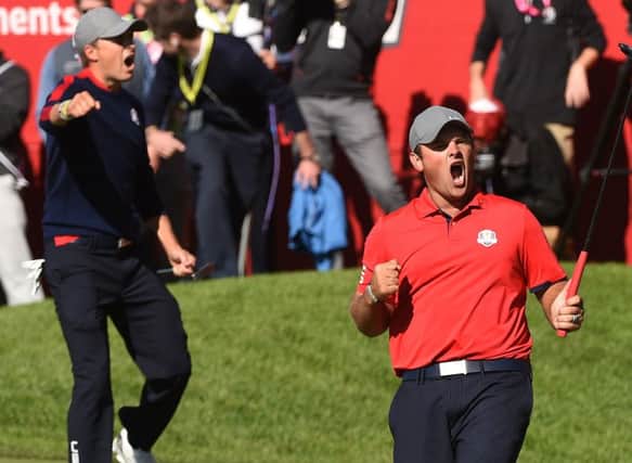 Patrick Reed, right, and Jordan Spieth celebrate after beating Justin Rose and Henrik Stenson in the first match at Hazeltine. Picture: Getty Images