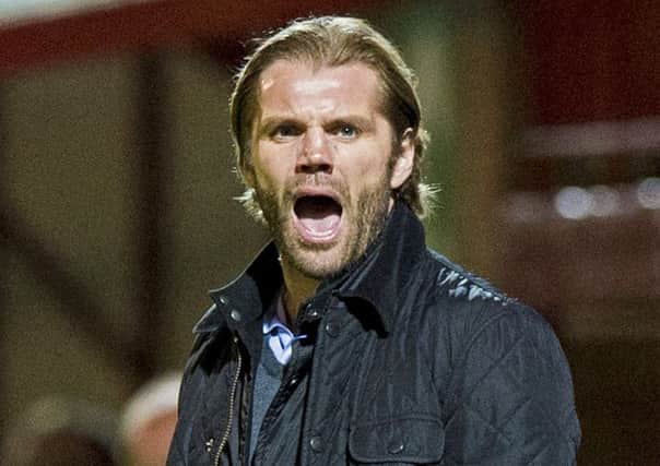 Hearts manager Robbie Neilson delivers instructions at Fir Park