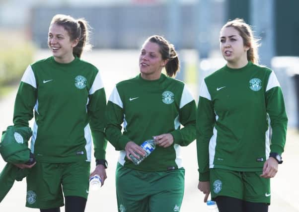 Hibs Ladies' Lizzie Arnot, Lisa Robertson and Clare Williamson are in good spirits ahead of tonight's match. Pic: PA