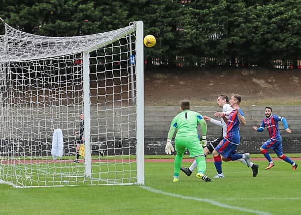 City goalkeeper Andrew Stobie can only watch on as Elgin winger Chris Dodds cross-cum-shot went in after three minutes