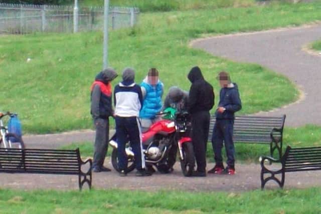 Youths with a suspected stolen motorbike.