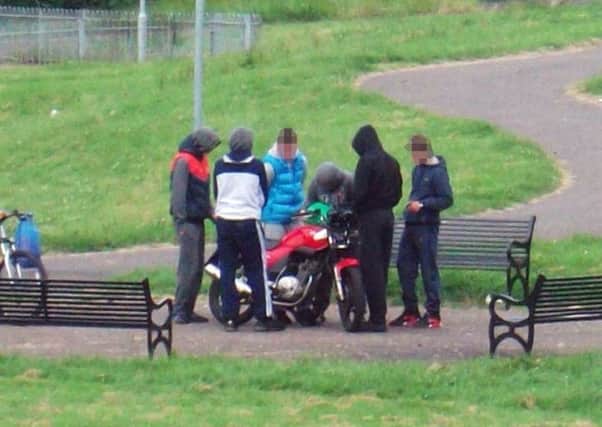 Youths with a suspected stolen motorbike.