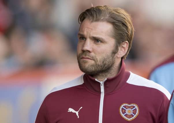 Hearts head coach Robbie Neilson says Paul Hartley, pictured below, will succeed at Dundee