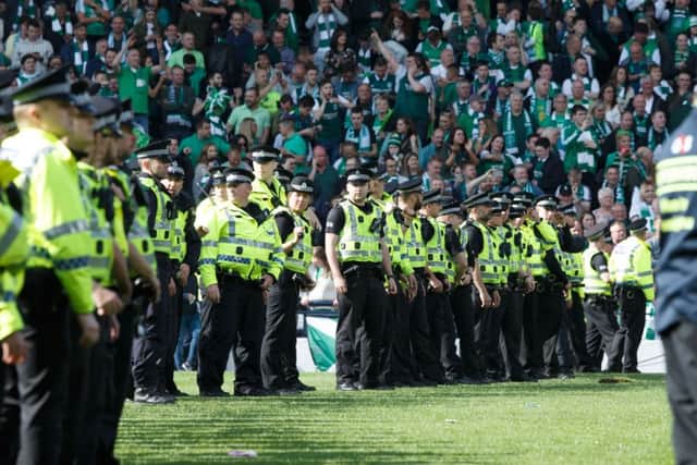 Police on the halfway line. Picture; Robert Perry