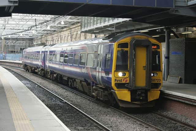 A train arriving at Edinburgh Waverley Station.