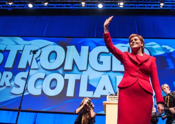 Nicola Sturgeon takes the applause of SNP delegates. Picture: John Devlin