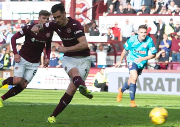 Jamie Walker hopes that, by maintaining his strong Hearts form, he can earn a Scotland call-up