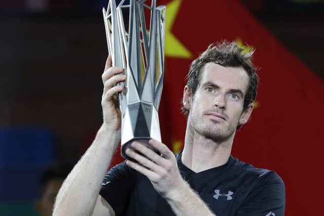 Andy Murray shows off the Shanghai Masters trophy