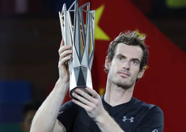 Andy Murray shows off the Shanghai Masters trophy