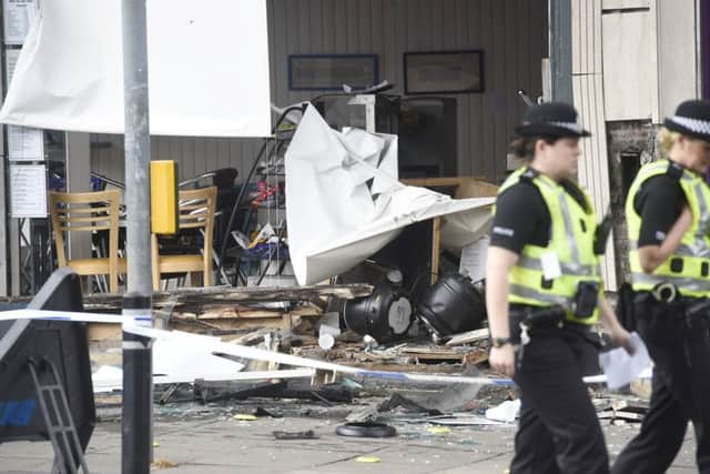 Fogerty hit Adam Ridley then smashed into the Empire Cafe. Picture: Greg Macvean
