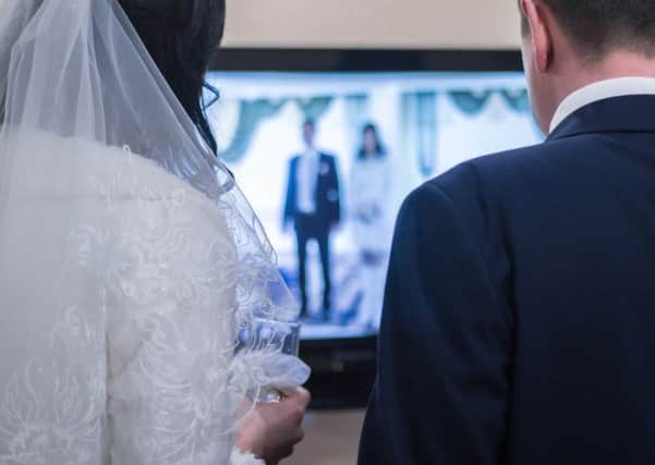 Susan would like to check her wedding video for evidence. Picture: Getty Images/iStockphoto