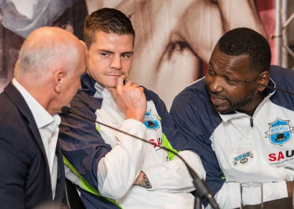 Clifton Mitchell, right, goes on the offensive at Josh Taylor's trainer Barry McGuigan as his own boxer, Dave Ryan, looks on. Pic: Ian Georgeson