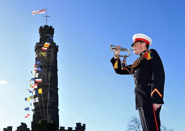 Buggler Chris Trowbridge  from the Royal Marines Band at the Nelson Monument on Calton Hill