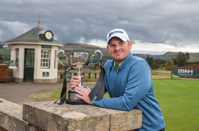 West Linton's Gareth Wright shows off the M&H Logistics Scottish PGA Championship trophy after his play-off win at Gleneagles. Picture: Kenny Smith