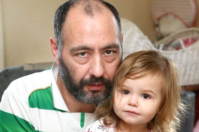 Sophie is pictured with her step-dad Mitchell McLaren with a box of the bugs collected.