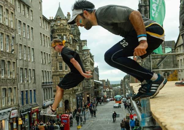 The Men's Health Rat Race hits edinburgh with obstacles set up around the city, including an air jump on The High Street. Picture: Toby Williams