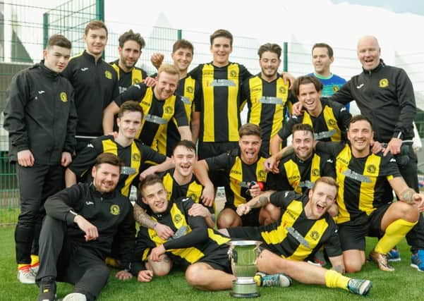 The Lothian Thistle Hutchison Vale players celebrate winning the Alex Jack Cup. Pic: Toby Williams