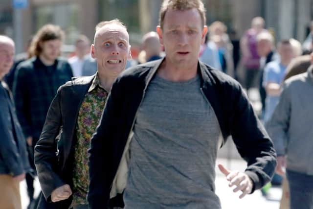 Actors Ewan McGregor and Ewan Bremner running through the streets of Edinburgh filming scenes for the new Trainspotting. Picture; Jane Barlow