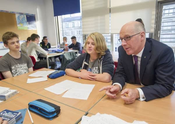 John Swinney speaks with pupils in the S4 National 5 Languages class at the new James Gillespie's High School.  Picture: Ian Rutherford