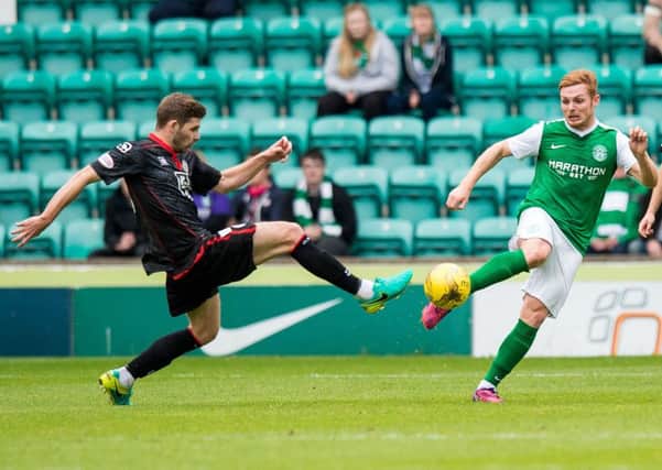 Fraser Fyvie is challenged by St Mirren's Kyle Hutton during Hibs' Irn-Bru Cup defeat earlier this month