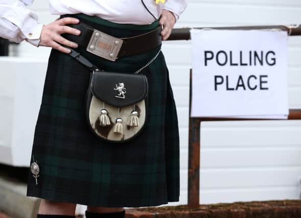 A voter outside a polling station in Fankerton, near Denny, on the day of the referendum on Scottish independence in 2014. Picture: Andrew Milligan/PA Wire