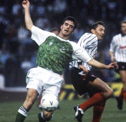 Hibs' Brian Hamilton falls after a challenge from Istvan Kozma. Hamilton recalls the 'incredible' celebrations that ensued after victory in 1991. Pic: SNS