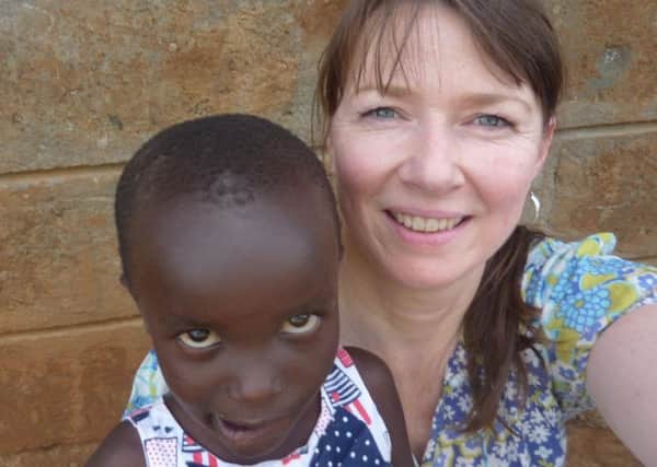Ailsa Thom with one of the children living at the orphanage