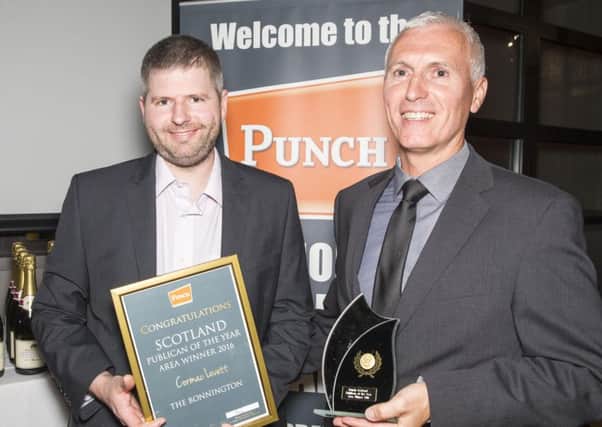 Cormac Lovett, left, receives his award from Brian Davidson