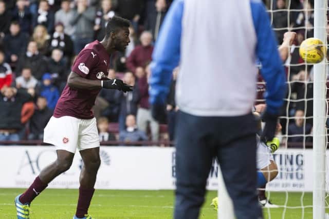 Prince Buaben heads home the opening goal at Tynecastle