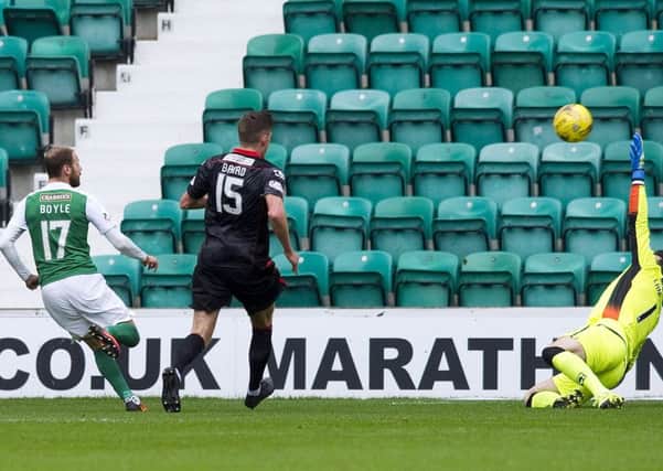 Martin Boyle clips the ball beyond Saints goalkeeper Jamie Langfield after racing through to meet Andrew Shinnies superbly-weighted pass