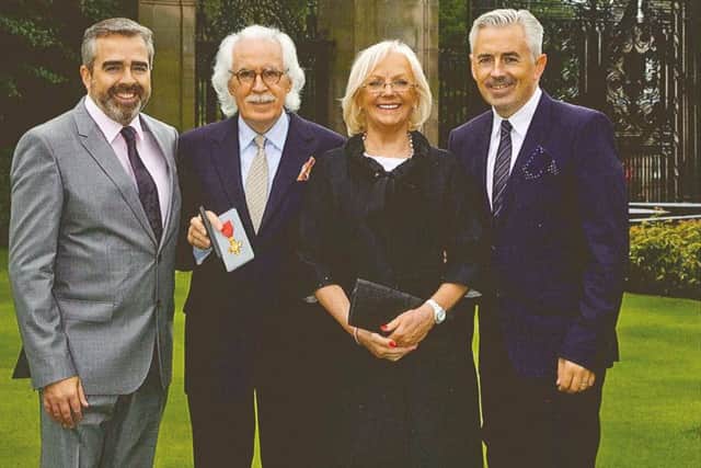 Charlie - after receiving his OBE - with his sons and wife Janet. Picture; contributed