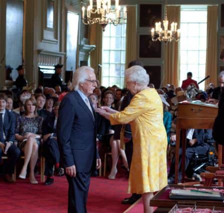 Charlie Miller receives his OBE from the Queen at the Palace of Holyroodhouse. Picture; contributed