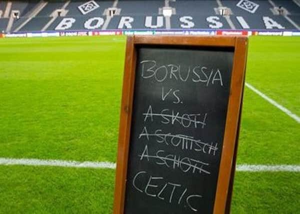 A Scottish side, Celtic. Gladbach respond with a sign of their own.