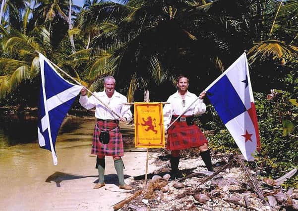 Stewart Redwood and Don Taylor of the St Andrew's Society of Panama fly the Scotland flag at the site of Fort St Andrews in the former colony of Caledonia in 1998. They arrived on the 300th anniversary of the Scots fleet entering Caledonia Bay for the first time. Copyright Stewart Redwood.
