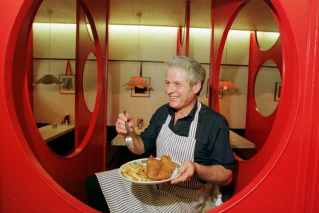 Joe Brattisani enjoys some of his own fish and chips at the Newington Road branch in 1998. Picture: TSPL