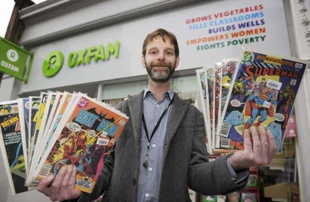 Stephen McMahon with some of the rare comics that were handed in to the Oxfam store on Morningside Road. Picture: Neil Hanna