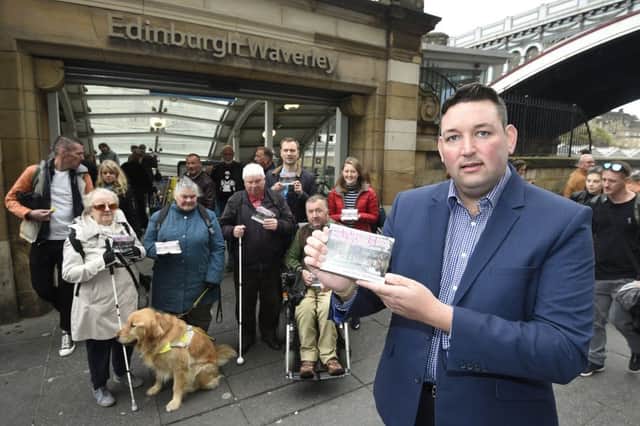 Miles Briggs launches a petition at Waverley Station along with members of the Edinburgh Access Panel to allow for taxis to get access to the station for dropping off passengers with disabilities. Picture: Greg Macvean
