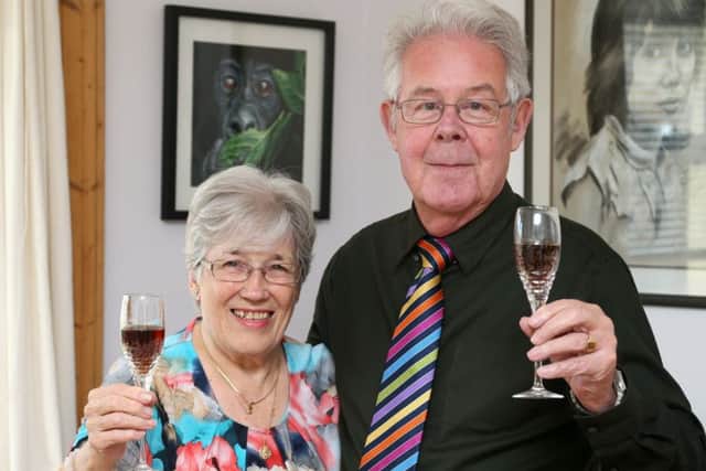 Ian and Laura Buchanan toast their years of happiness. Picture: Gordon Fraser