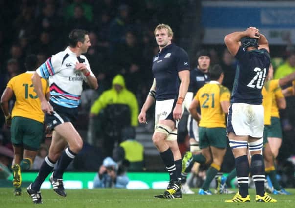 Referee Craig Joubert sprints off the field after Scotland's World Cup defeat by Australia. Pic: SNS