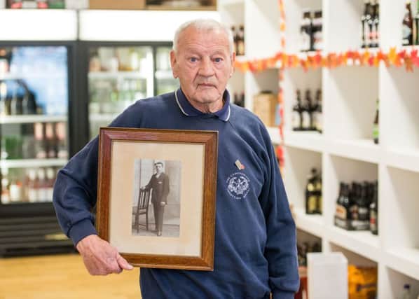 George Leadbetter  with a picture of his dad James Leadbetter, a veteran of the First World War. Picture: Ian Georgeson/TSPL