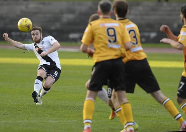 Ross Allum lines up a free-kick against Annan Athletic. Pic: Neil Hanna