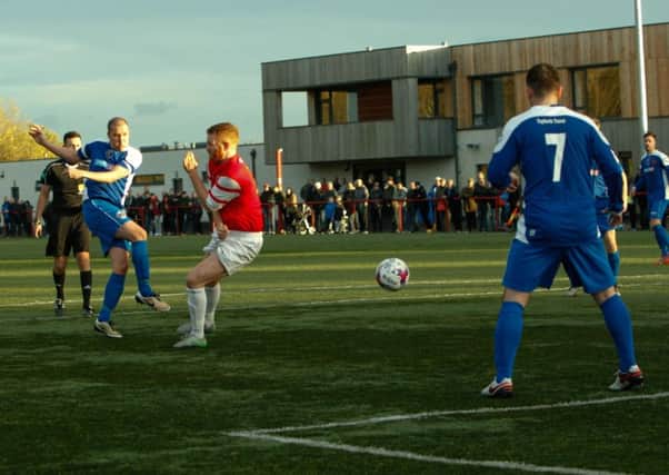 Michael Gemmell fires home Bo'ness United's second goal at Broxburn. Picture: Toby Williams