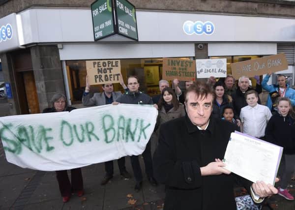 Tommy Sheppard MP joins locals outside the TSB in Craigmillar which is threatened with closure. Picture; Greg Macvean